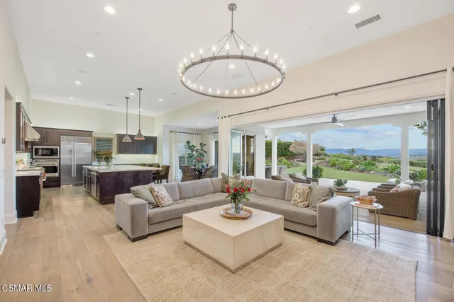 a spacious bedroom with a large bed and a large window