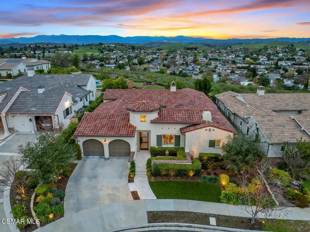 a view of patio with couches and a fire pit