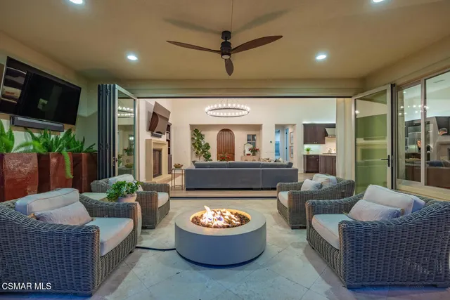 a view of a house with backyard and porch