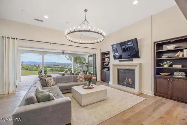 a dining room with furniture window and wooden floor