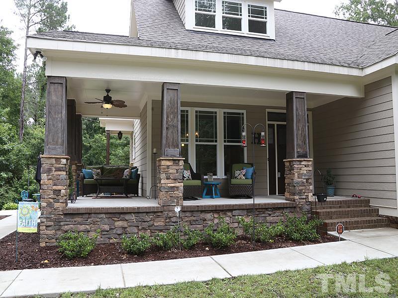 7401 Denlee Road Raleigh, NC 27603 - Photo 2 of 25 a front view of a house with a yard