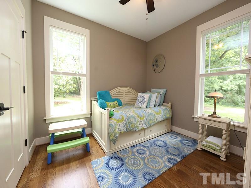 7401 Denlee Road Raleigh, NC 27603 - Photo 13 of 25 a bedroom with a bed and a window