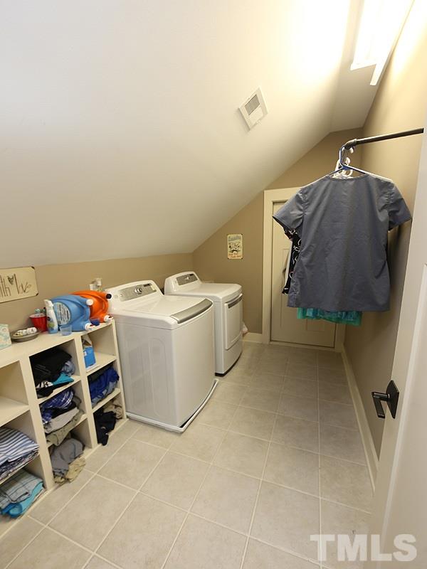 7401 Denlee Road Raleigh, NC 27603 - Photo 23 of 25 a utility room with dryer and washer