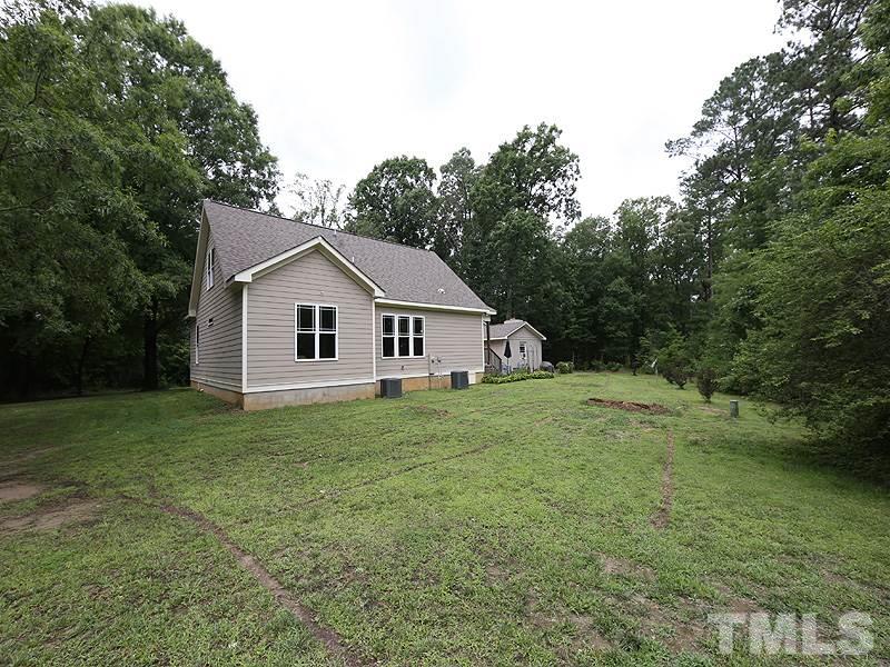 7401 Denlee Road Raleigh, NC 27603 - Photo 24 of 25 a view of a house with a yard