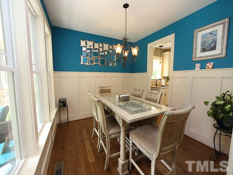 7401 Denlee Road Raleigh, NC 27603 - Photo 6 of 25 a view of a dining room with furniture window and wooden floor