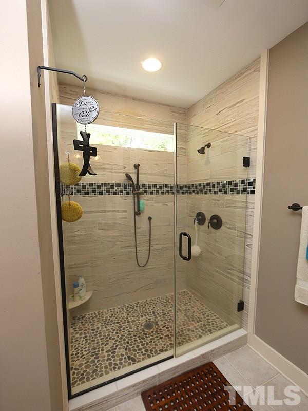 7401 Denlee Road Raleigh, NC 27603 - Photo 8 of 25 a bathroom with a shower