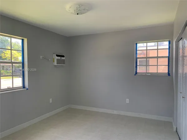an empty room with windows