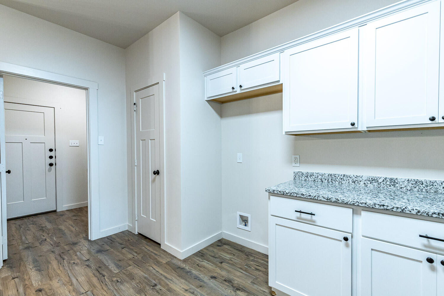 5527 121st Street, Unit A Lubbock, TX 79424 - Photo 21 of 41 a kitchen with granite countertop white cabinets and a window
