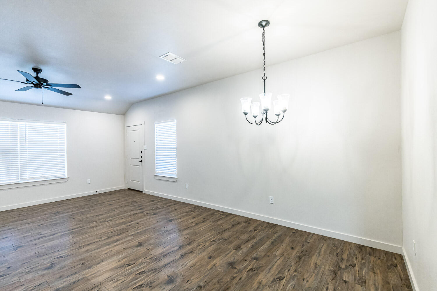 5527 121st Street, Unit A Lubbock, TX 79424 - Photo 10 of 41 a view of a room with wooden floor and ceiling fan