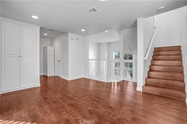 a view of a living room and hardwood floor