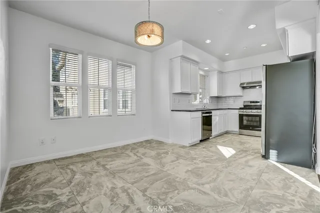 a view of a house with wooden fence
