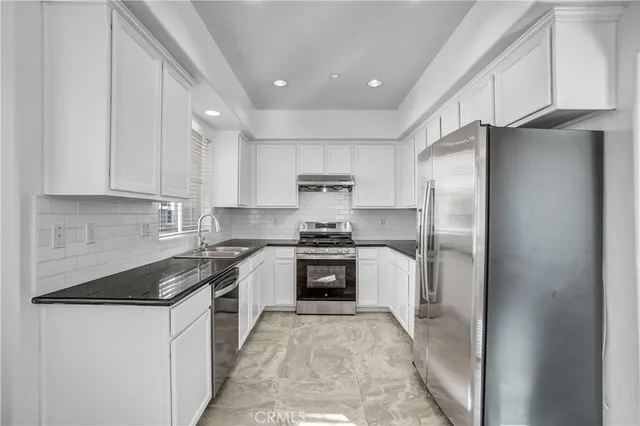 a view of a kitchen with a sink
