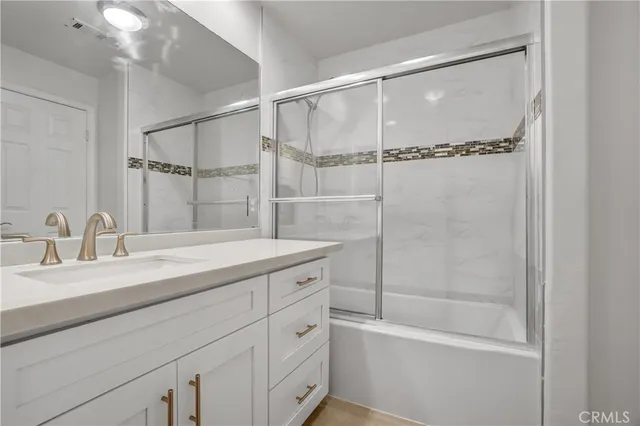 a view of a room with rack on the wall and a window