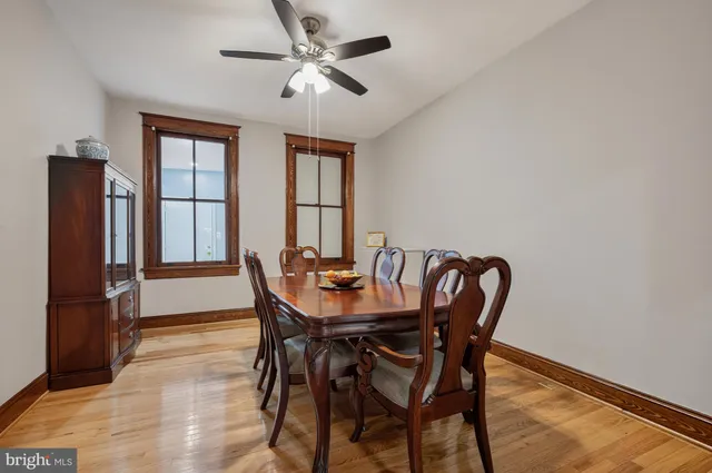 a kitchen with a refrigerator and a stove top oven