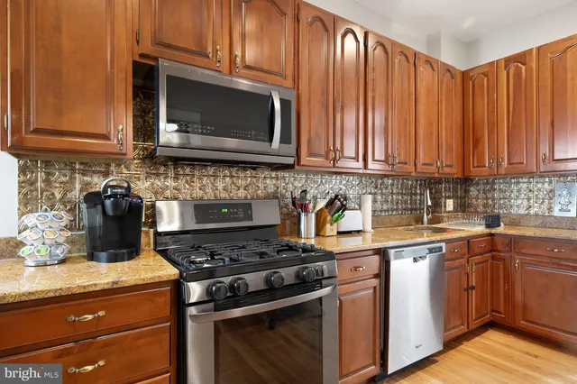 a view of hallway with wooden floor