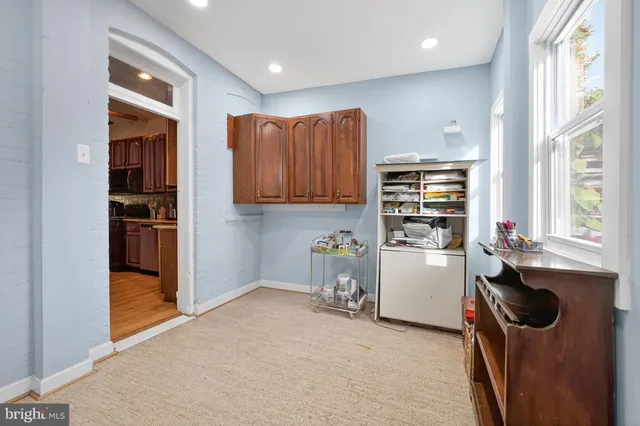 a bedroom with a bed and a table in it