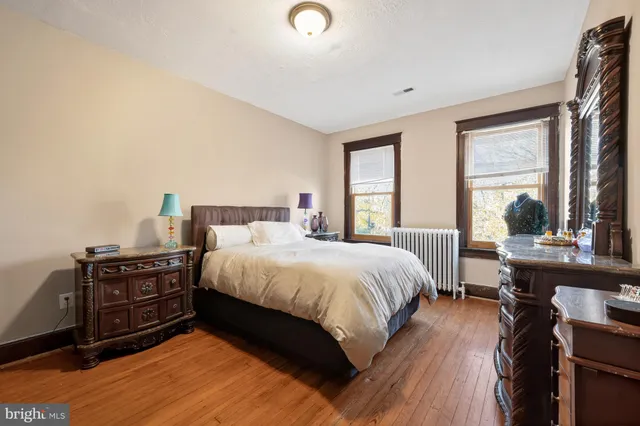 a living room with furniture a rug and a table
