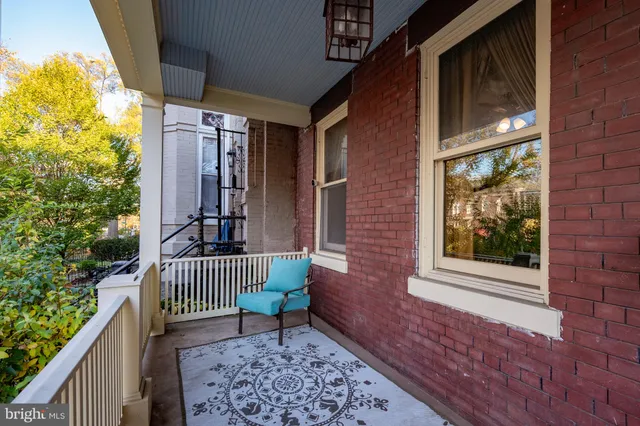 a view of a livingroom with furniture and a fireplace