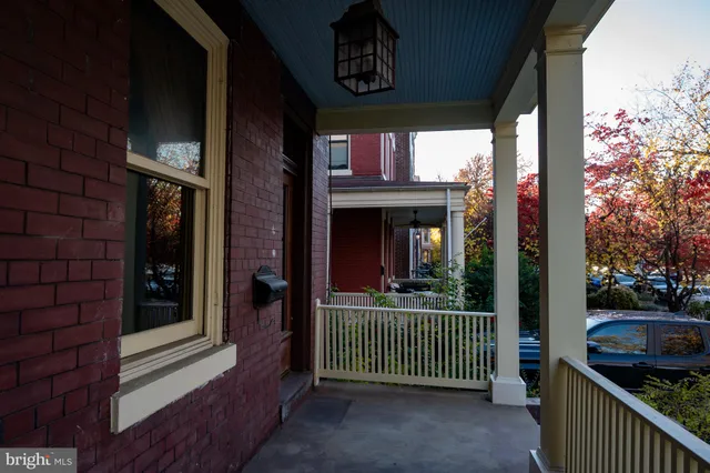 a view of hallway with furniture and a window