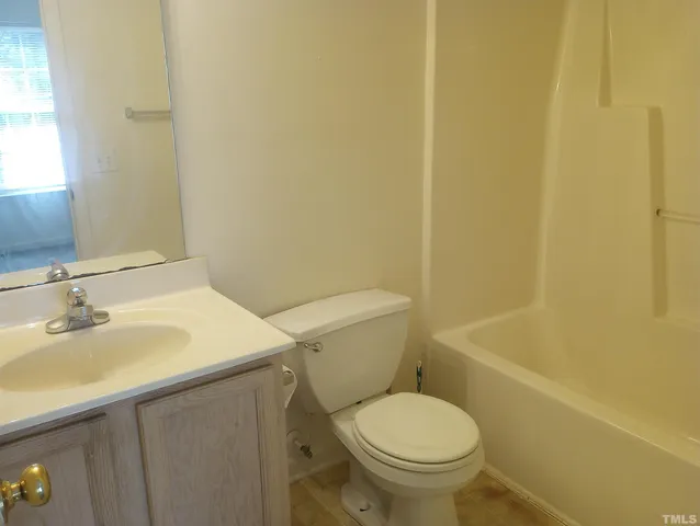 a bathroom with a sink a toilet and a bathtub