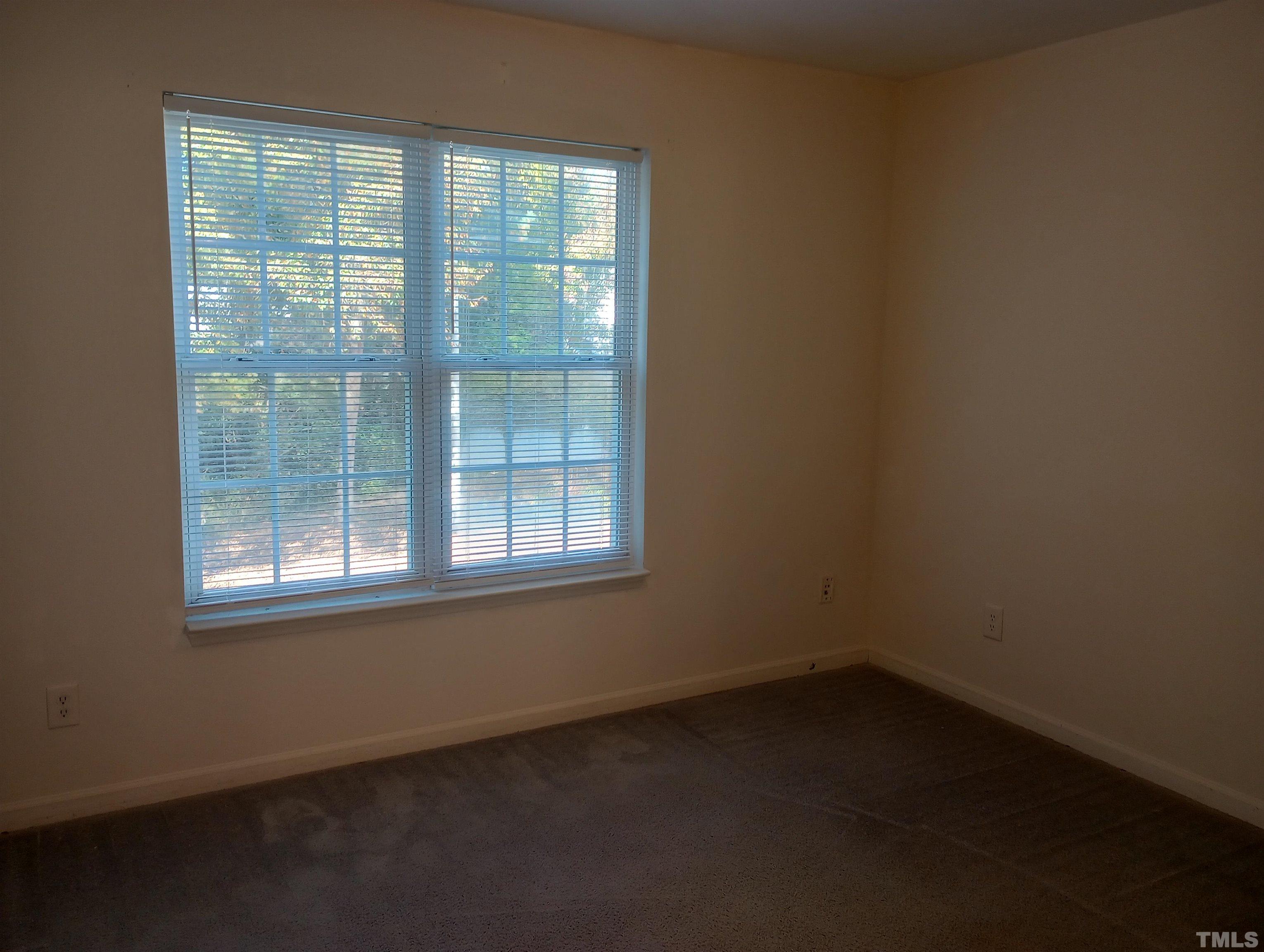 65 Red Lane Raleigh, NC 27606 - Photo 18 of 24 an empty room with a window