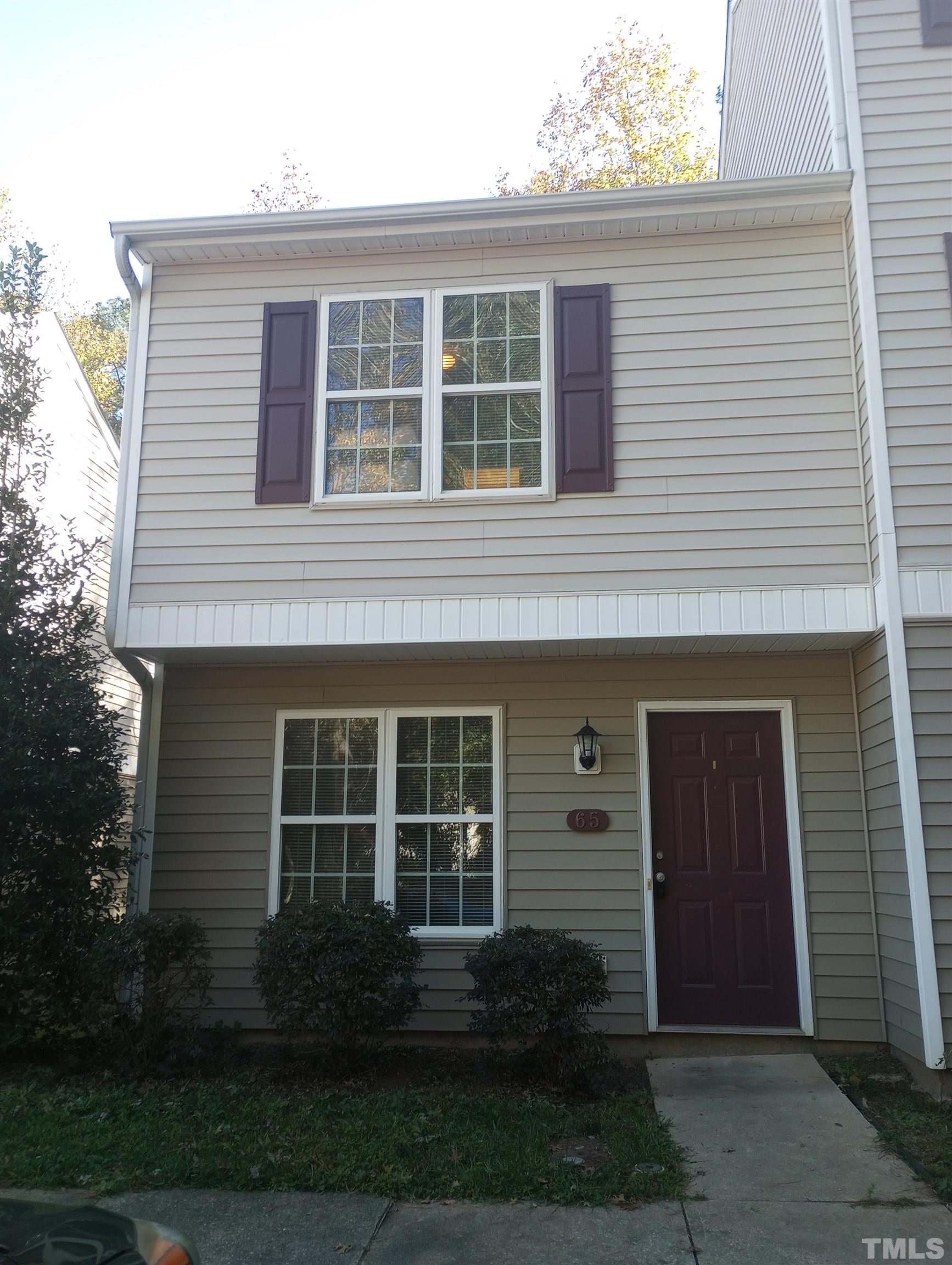 65 Red Lane Raleigh, NC 27606 - Photo 2 of 24 a front view of a house with garden
