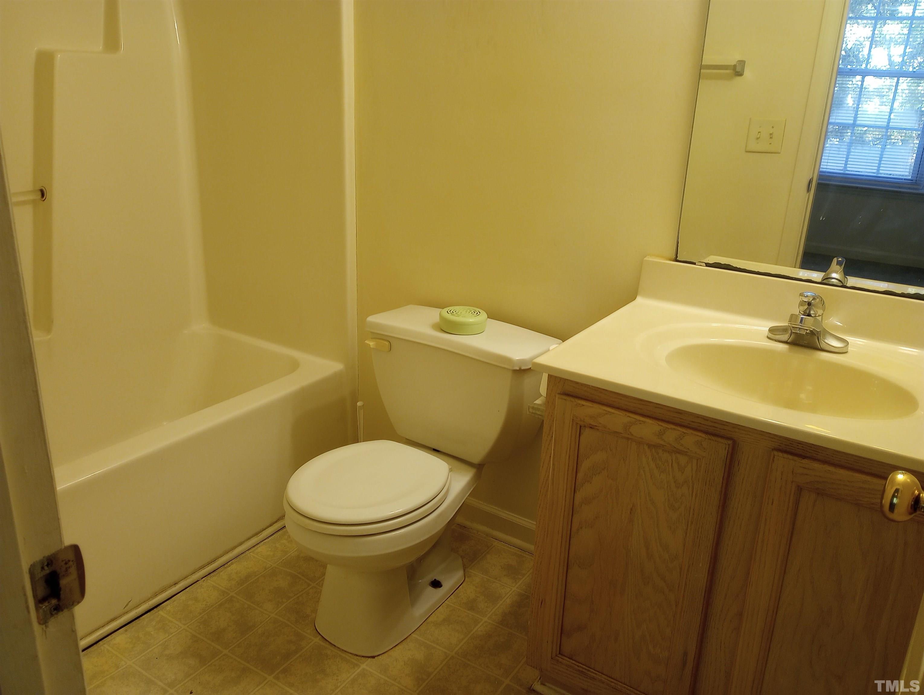 65 Red Lane Raleigh, NC 27606 - Photo 21 of 24 a bathroom with a sink and a toilet
