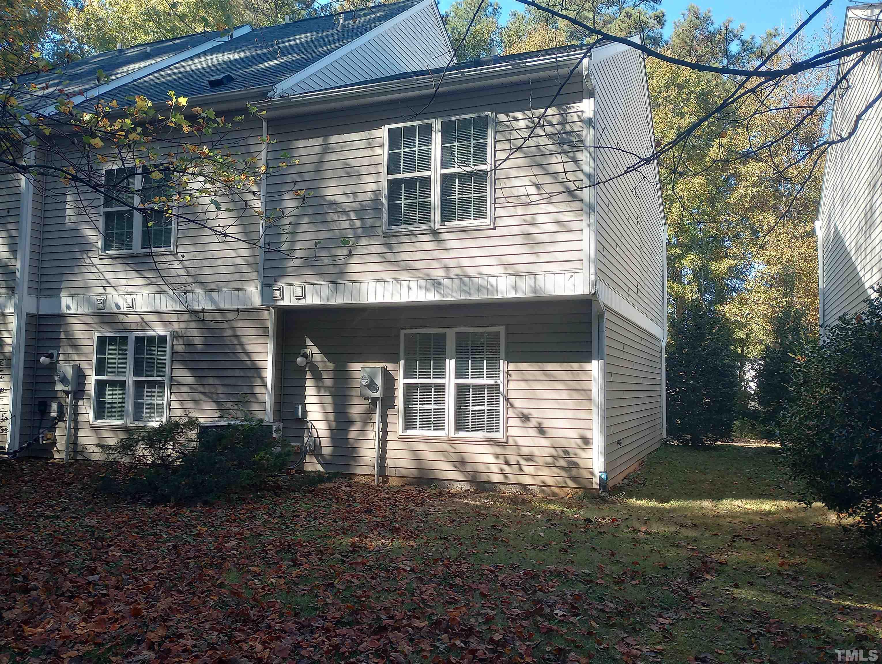65 Red Lane Raleigh, NC 27606 - Photo 22 of 24 a front view of a house with a yard