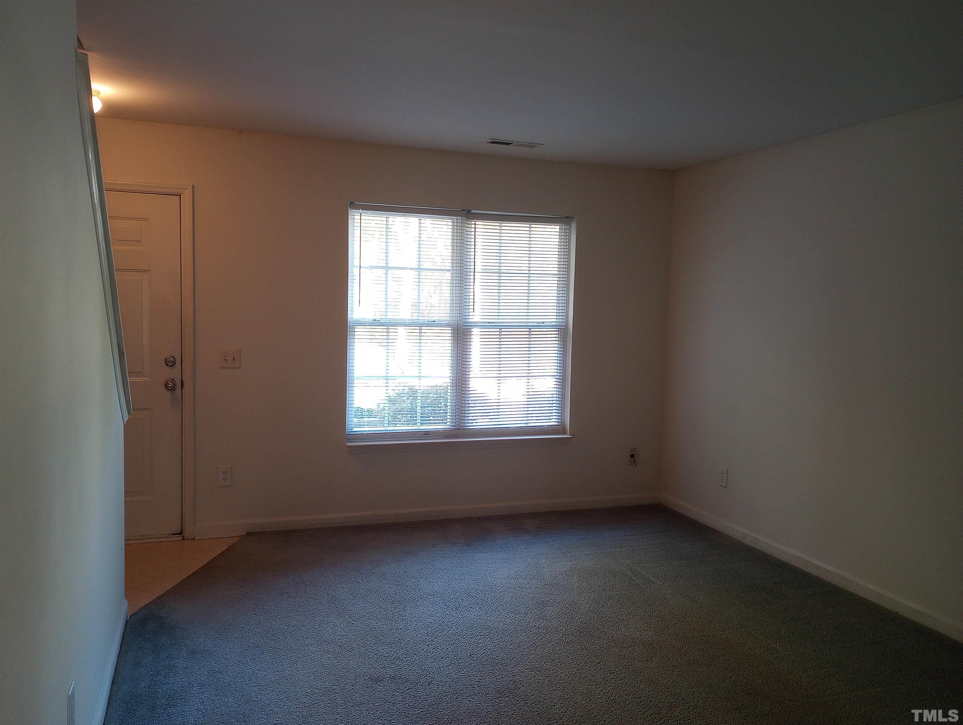 65 Red Lane Raleigh, NC 27606 - Photo 4 of 24 an empty room with a window