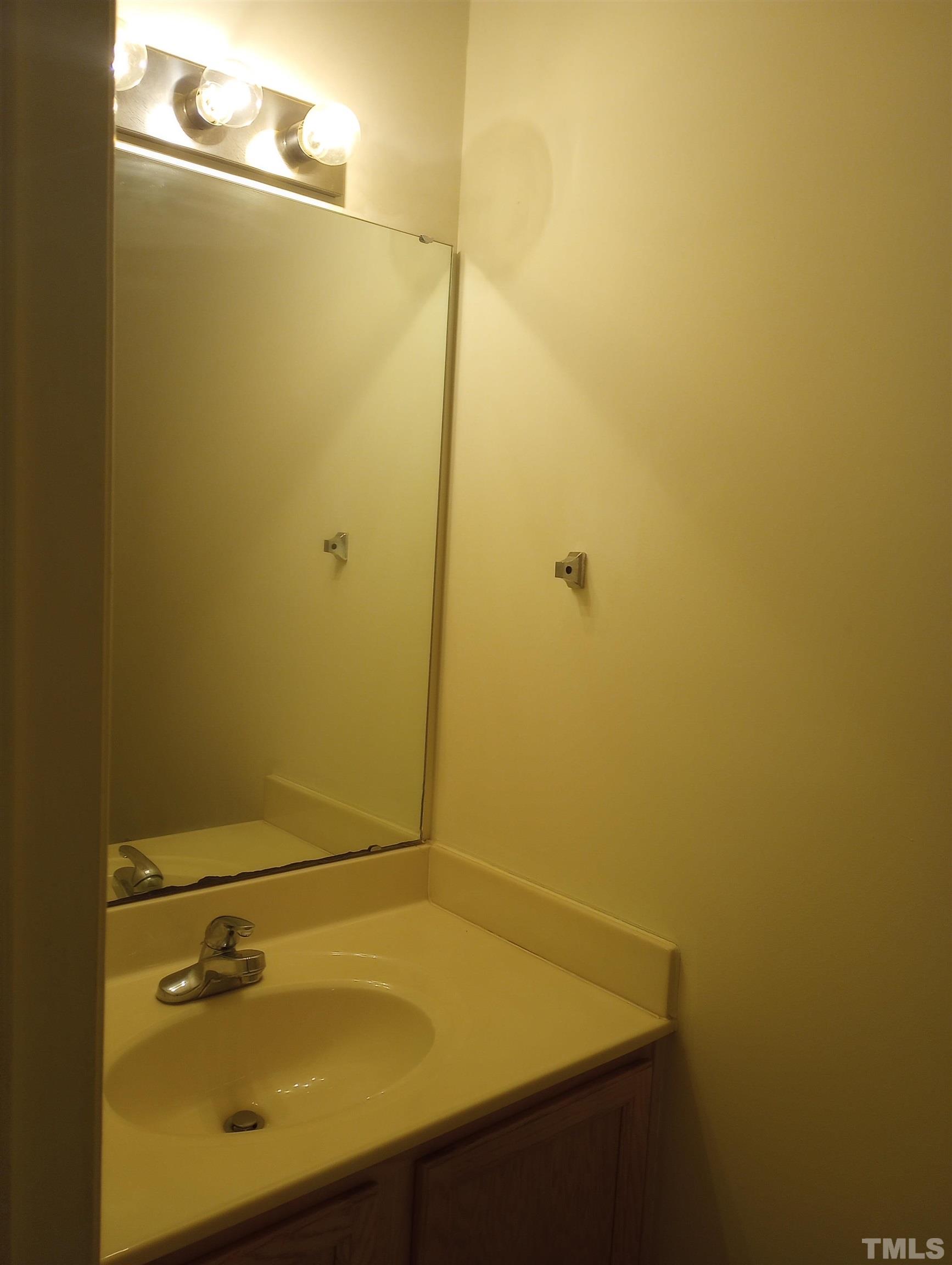 65 Red Lane Raleigh, NC 27606 - Photo 5 of 24 a bathroom with a sink