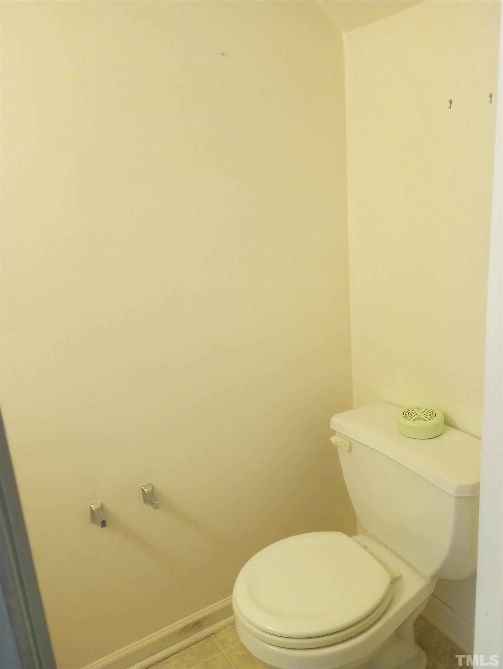 65 Red Lane Raleigh, NC 27606 - Photo 6 of 24 a white toilet sitting next to a shower