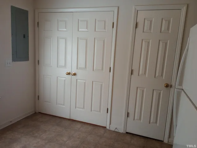 a view of a door with wooden floor