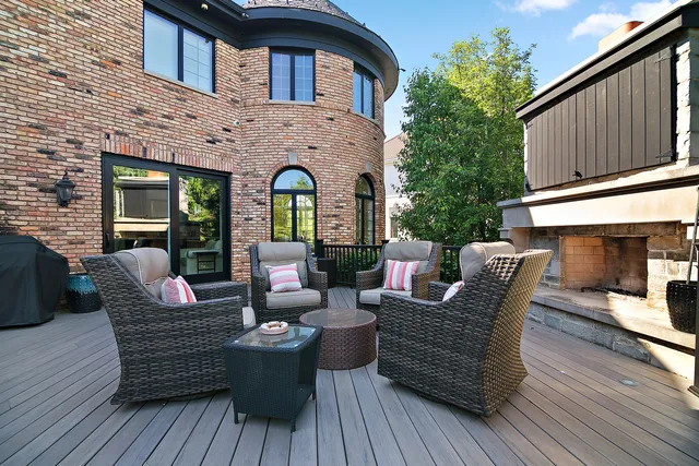 a view of a livingroom with wooden floor and stairs