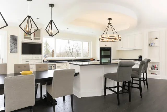 an aerial view of a house with garden space and street view