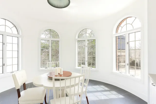 an aerial view of a house with yard swimming pool and outdoor seating