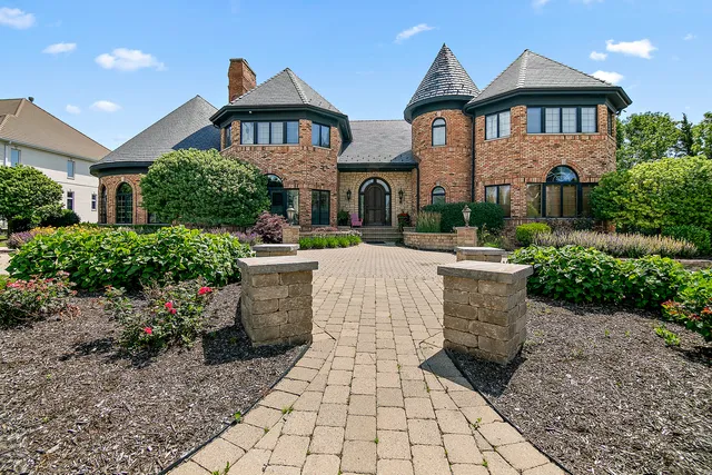 a view of a patio with couches and potted plants