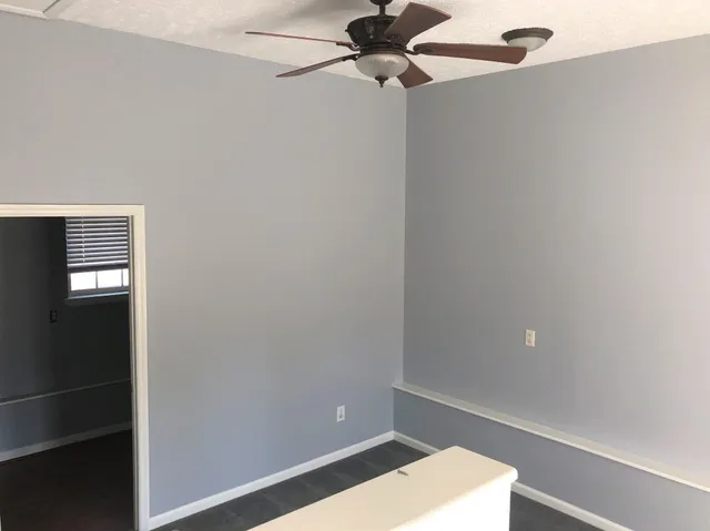 a view of a room with a fan