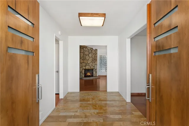 a view of a hallway view with wooden floor and staircase