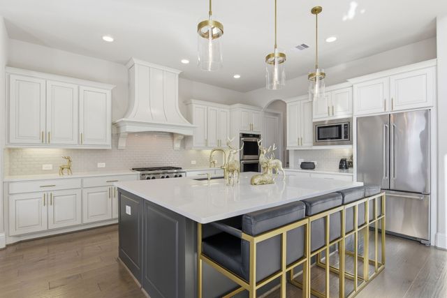 a spacious bathroom with a tub sink shower and mirror