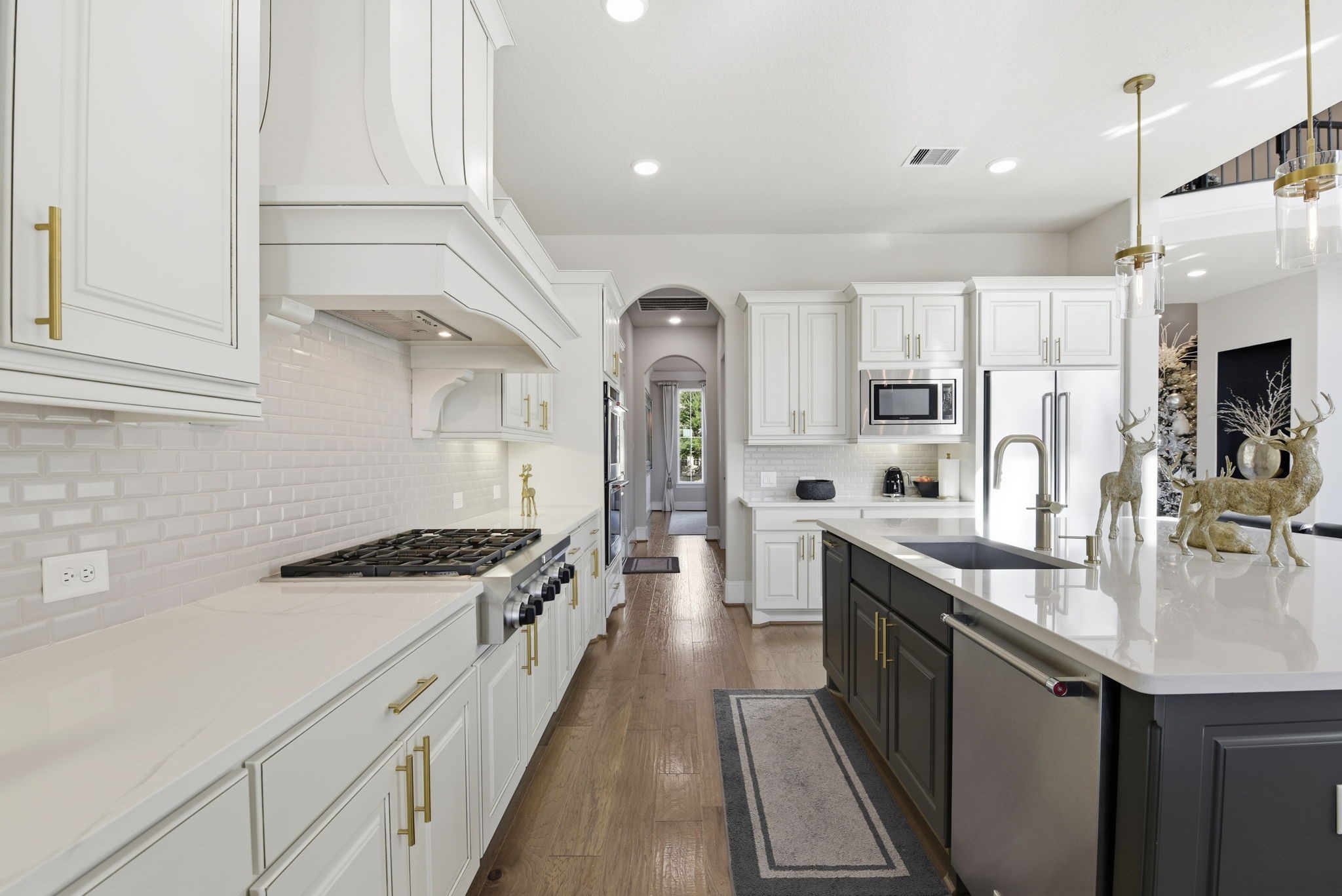 5811 Stratton Woods Dr Spring Spring, TX 77389 - Photo 19 of 38 a kitchen with stainless steel appliances granite countertop a sink a stove and a refrigerator
