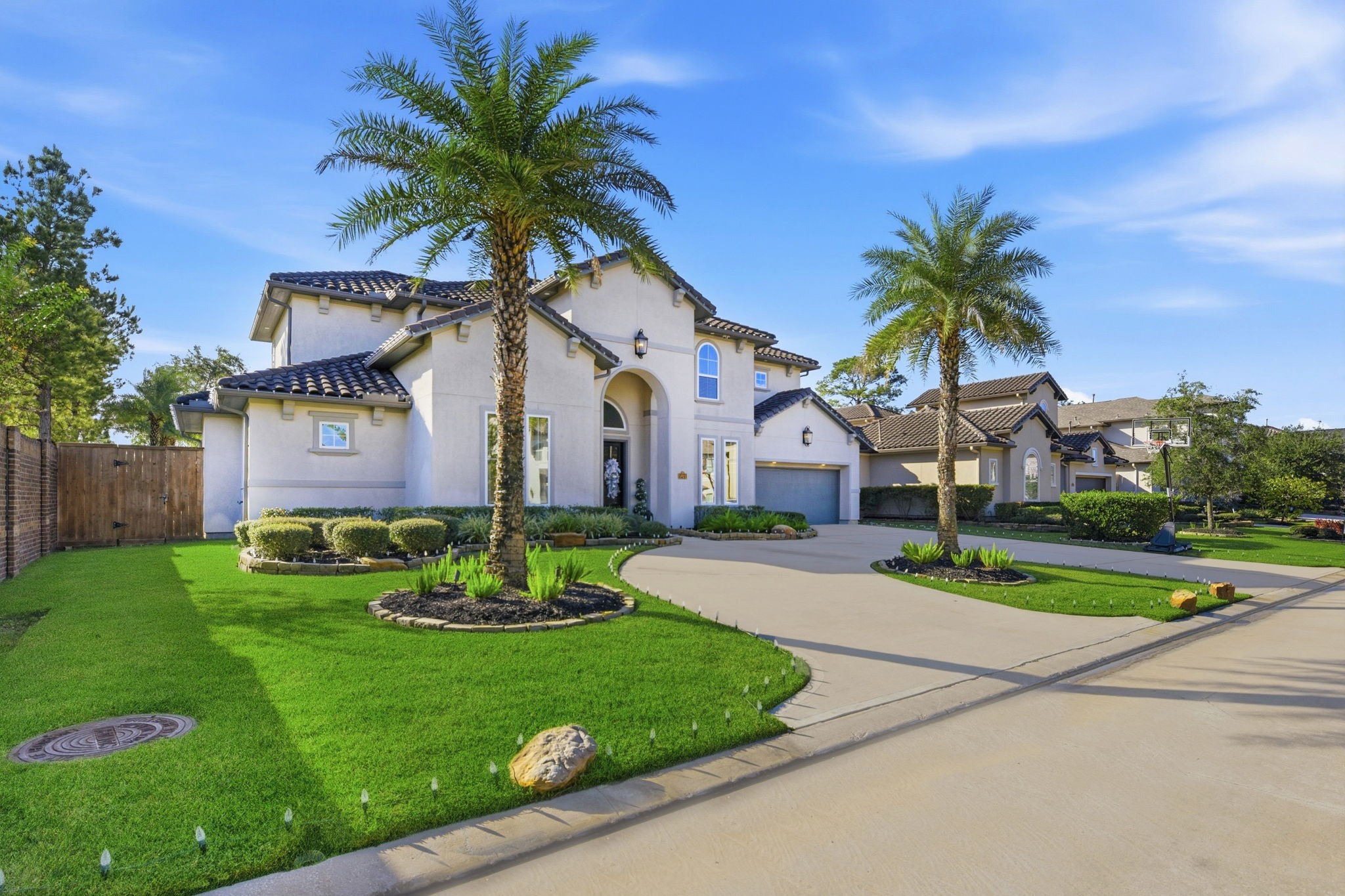 5811 Stratton Woods Dr Spring Spring, TX 77389 - Photo 2 of 38 a front view of a house with a garden and trees