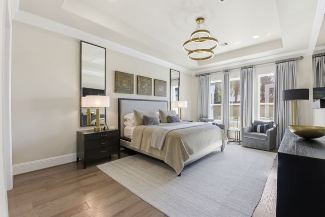 a front view of a house with a yard glass top table and chairs