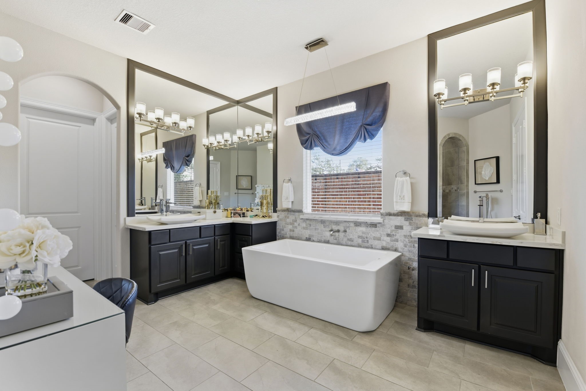 5811 Stratton Woods Dr Spring Spring, TX 77389 - Photo 27 of 38 a spacious bathroom with a tub sink shower and mirror