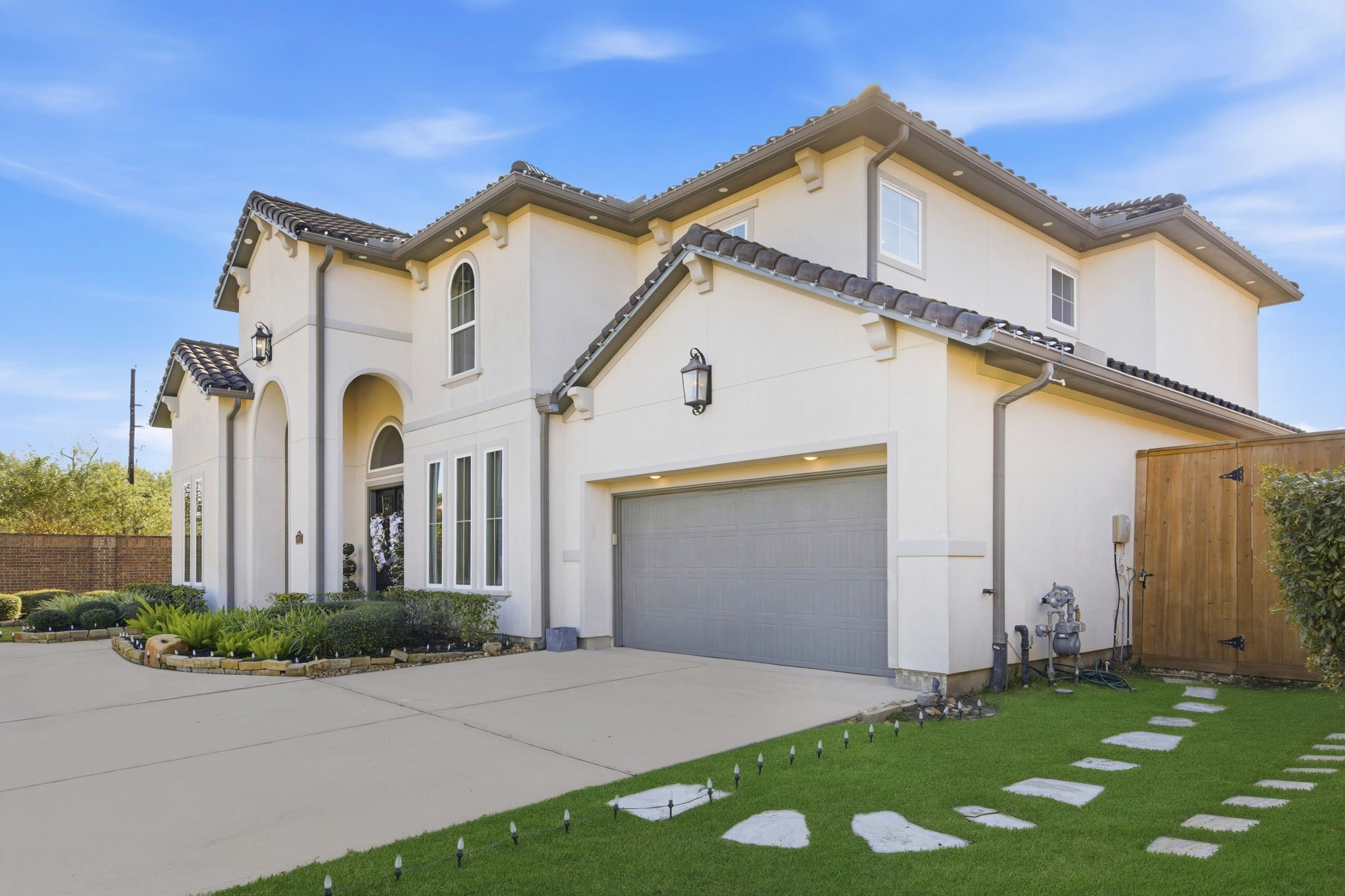 5811 Stratton Woods Dr Spring Spring, TX 77389 - Photo 4 of 38 a front view of a house with a yard and garage