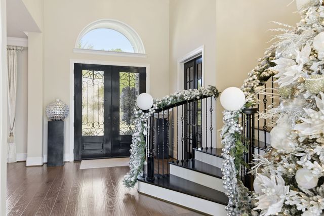 a living room with furniture large window and a fireplace