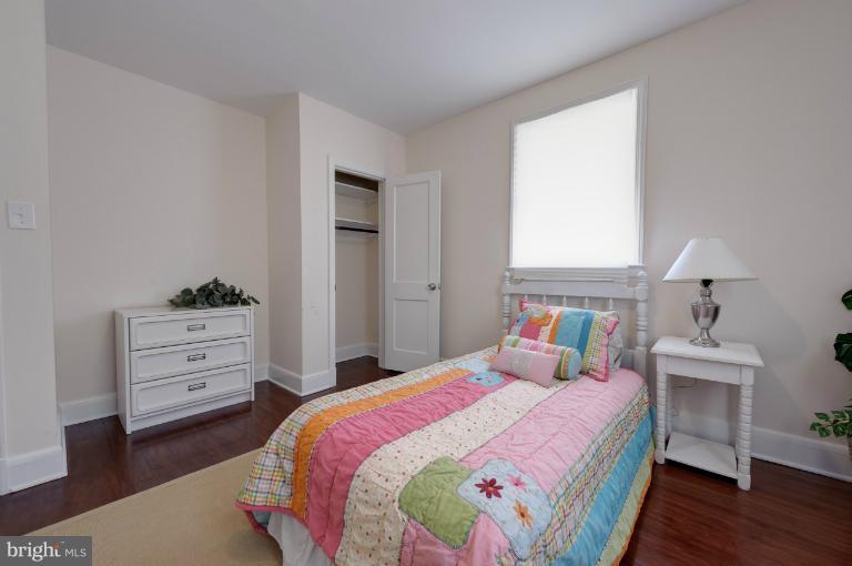 713 Charing Cross Road Baltimore, MD 21229 - Photo 2 of 29 a bedroom with a bed and a dresser