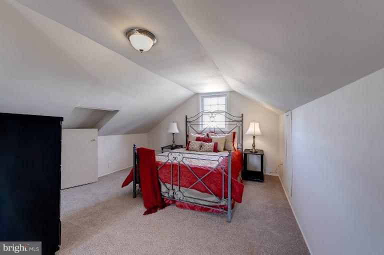 713 Charing Cross Road Baltimore, MD 21229 - Photo 17 of 29 a bed room with furniture and window