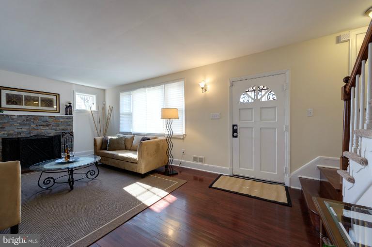 713 Charing Cross Road Baltimore, MD 21229 - Photo 23 of 29 a living room with furniture and a fireplace
