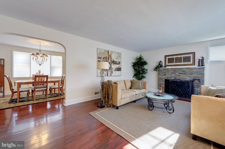 713 Charing Cross Road Baltimore, MD 21229 - Photo 26 of 29 a living room with furniture and a fireplace