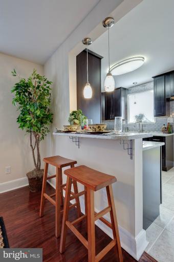 713 Charing Cross Road Baltimore, MD 21229 - Photo 27 of 29 a kitchen with a table and chairs in it